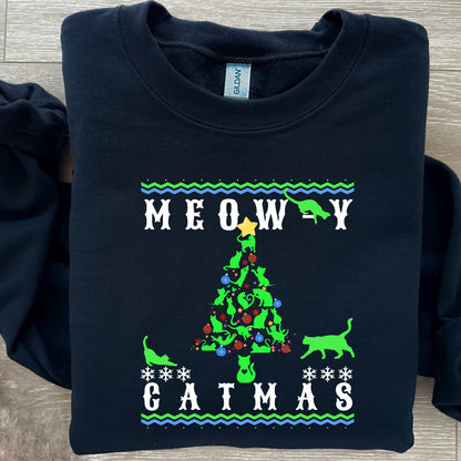 &#39;Black Meowy Catmas&#39; holiday sweatshirt with a whimsical cat-themed Christmas tree design,