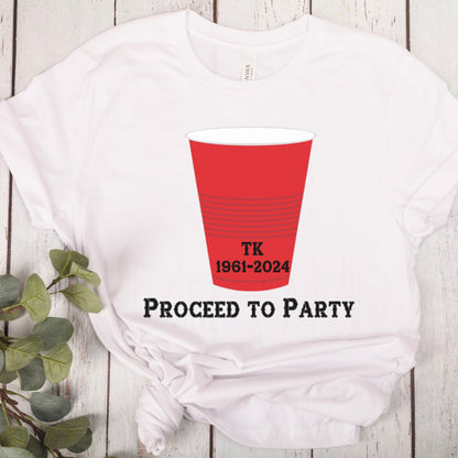 White T-shirt with a red party cup graphic and text. The cup has the initials TK and the years 1961-2024 printed on it